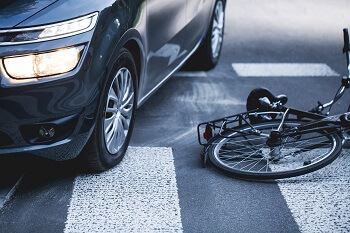 Bicycle in the Street After Accident with Car